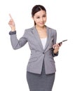 Asian businesswoman hold with tablet and finger point up Royalty Free Stock Photo