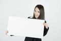 Asian businesswoman holding blank white card board sign. Royalty Free Stock Photo