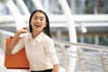 Asian businesswoman holding colorful paper shopping bags on hand , business consumer concept Royalty Free Stock Photo