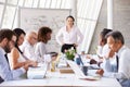Asian Businesswoman Leading Meeting At Boardroom Table Royalty Free Stock Photo