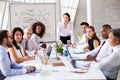 Asian Businesswoman Leading Meeting At Boardroom Table Royalty Free Stock Photo