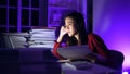 Asian businesswoman online working hard late hours with laptop at home. Busy and exhausted of work at night Royalty Free Stock Photo