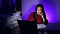 Asian businesswoman online working hard late hours with laptop at home. Busy and exhausted of work at night Royalty Free Stock Photo