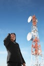 Asian businesswoman on phone and antenna