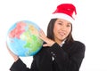 Asian businesswoman with santa hat and globe Royalty Free Stock Photo