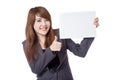 Asian businesswoman show thumbs up hold a blank sign Royalty Free Stock Photo