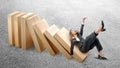 Asian businesswoman slipped on topple wooden block Royalty Free Stock Photo