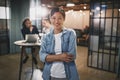 Asian businesswoman smiling with colleagues sitting in the backg Royalty Free Stock Photo