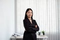 Asian businesswoman. stand happy smile Proud of business success the office