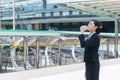 Asian businesswoman standing and drinking pure mineral water from plastic bottle. with copy space Royalty Free Stock Photo