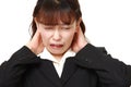 Asian businesswoman suffers from neck ache