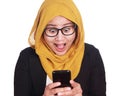 Asian businesswoman surprised, amazed expression looking at her phone Royalty Free Stock Photo