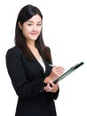 Asian businesswoman take note on clipboard