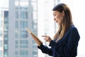 Asian businesswoman using digital tablet working in hotel room Royalty Free Stock Photo