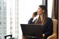 Asian businesswoman using laptop working in hotel room Royalty Free Stock Photo