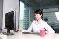 Asian businesswoman working with computer in offi