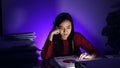 Asian businesswoman working hard late hours with a lot of document at home. Busy and exhausted of work  at night Royalty Free Stock Photo