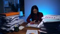 Asian businesswoman working hard late hours with a lot of document at home. Busy and exhausted of work overtime Royalty Free Stock Photo