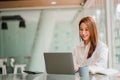 Asian businesswoman working in the office with laptop financial documents gives a clear vision of work and success instilling trus