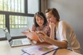 Asian businesswomen reading financial documents in the office Royalty Free Stock Photo