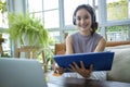 Asian businesswomen is using notebook computers and wear headphones for online meetings and working from home Royalty Free Stock Photo