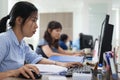 Asian businesswomen working computer sitting office