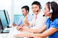 Asian call center agent team on phone Royalty Free Stock Photo