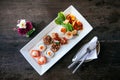 Asian canapes appetizer - Smoked salmon, maki, larb, tuna tartar Royalty Free Stock Photo
