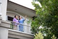 Asian caregiver woman or nurse on balcony with senior woman for relax with cozy at home.