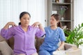 Asian caregiver woman or nurse training senior woman warmup for exercise while physical therapy.