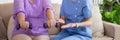 Asian caregiver woman or nurse training senior woman lifting dumbbell for arm exercise while therapy and rehabilitation. Royalty Free Stock Photo