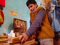 Asian carpenter finishing wood at art factory in India January 2020