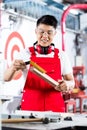 Asian Carpenter measuring piece of wood