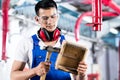 Asian Carpenter in wood workshop working Royalty Free Stock Photo