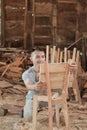 Asian carpenters work installing the backs of wooden chairs