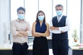 Asian and Caucasian businesspeople teamwork is wearing mask Preventing for Covid 19 virus is new normal and lifestyle of personnel