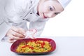 Asian chef's final touch Royalty Free Stock Photo