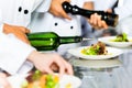 Asian Chef in restaurant kitchen cooking Royalty Free Stock Photo