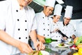 Asian Chef in restaurant kitchen cooking Royalty Free Stock Photo