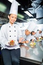 Asian Chef in restaurant kitchen cooking Royalty Free Stock Photo