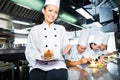 Asian Chef in restaurant kitchen cooking Royalty Free Stock Photo