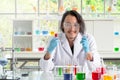 Asian chemist man checking liquid substance in test tubes Royalty Free Stock Photo