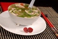 Asian chicken, glass noodle and rice soup with mushrooms and scallions Royalty Free Stock Photo