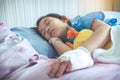 Asian child admitted in hospital with saline intravenous on hand Royalty Free Stock Photo