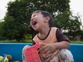 Asian child boy laughing with happy face outdoor with natural background. Royalty Free Stock Photo