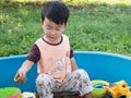 Asian child boy smiling with happy face outdoor with natural background. Royalty Free Stock Photo