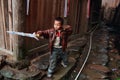 Asian child boy villager about 5 years old, playing outdoors