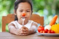 Asian child does not like to eat vegetables Royalty Free Stock Photo