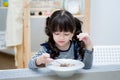 Asian child eat cereal and milk Royalty Free Stock Photo