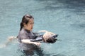 Asian child girl drowning in underwater,drowning female teenager in swimming pool,mother rescuing unconscious daughter drowning in